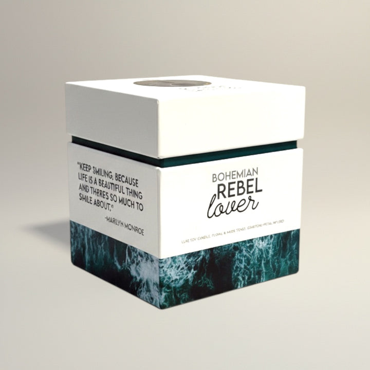 Cloque and Dagger Bohemian Rebel Lover candle in a white box with a dark green wave pattern and Marilyn Monroe quote.
