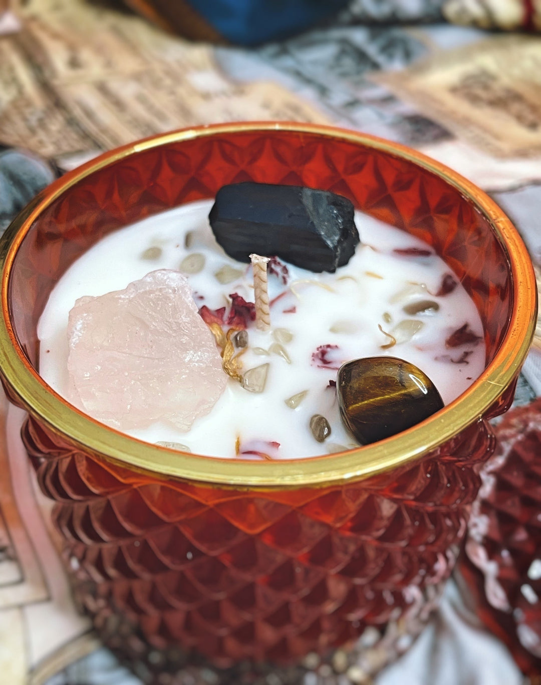 Cloque and Dagger red textured glass candle with gold rim, infused with Black Tourmaline, Rose Quartz, Tiger&